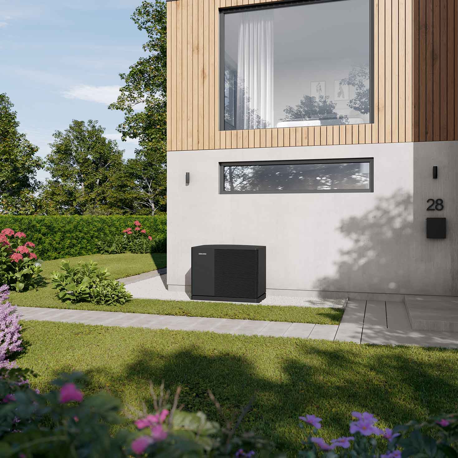 Wärmepumpe vor einem Neubau